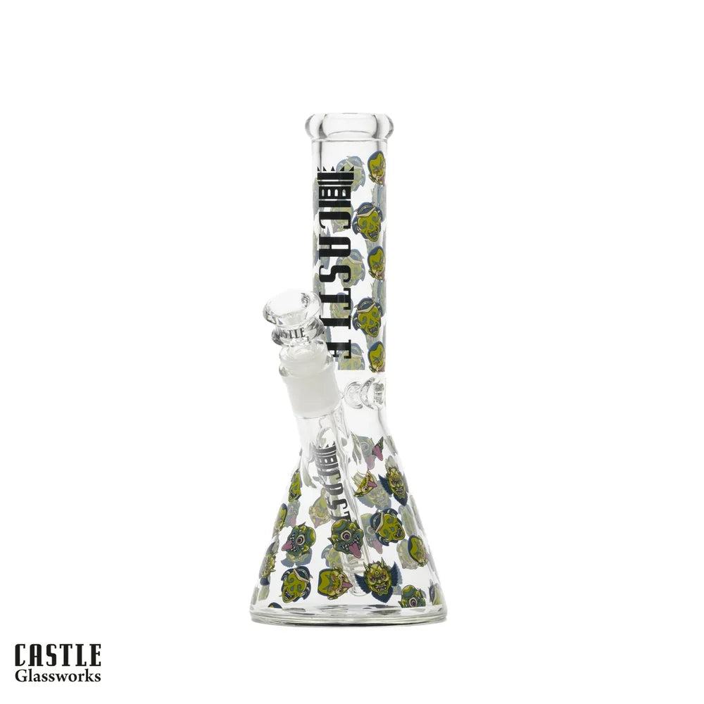 Castle Glassworks Mask beaker bong with colourful mask artwork, clear glass body, bowl and downstem