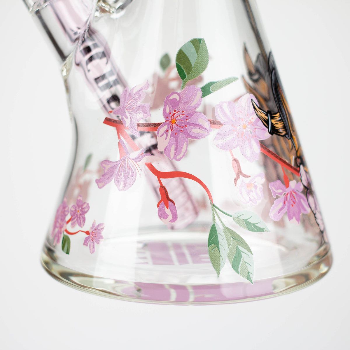 Cherry Blossom artwork on the base of the 16 Inch Cherry Blossom Beaker Bong from Castle Glassworks