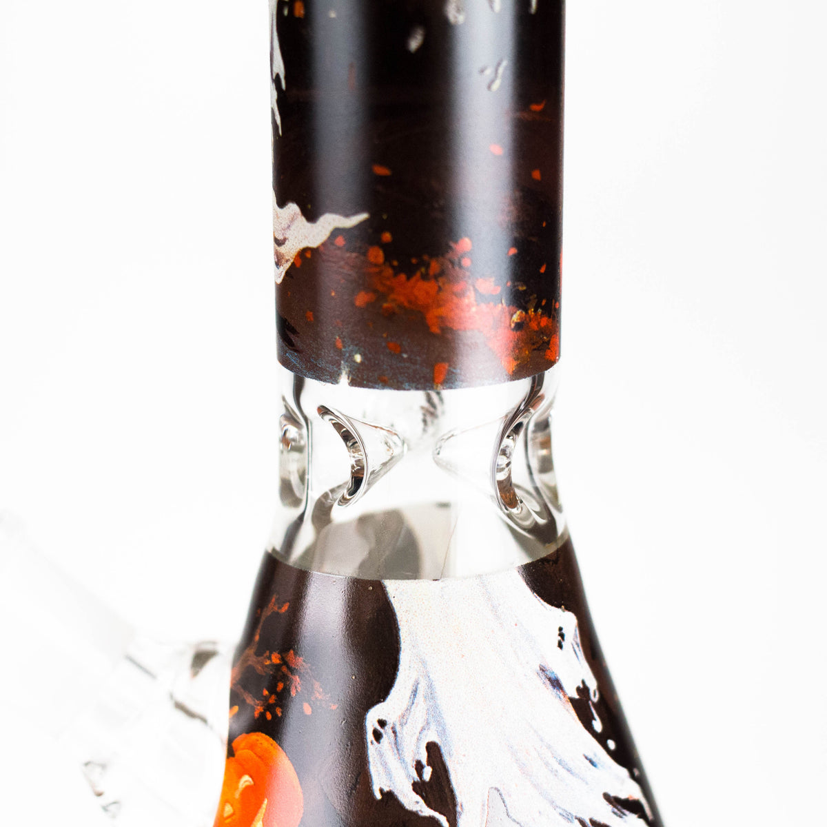 Close-up of clear glass ice pinches between the ghost bong neck and patterned beaker base