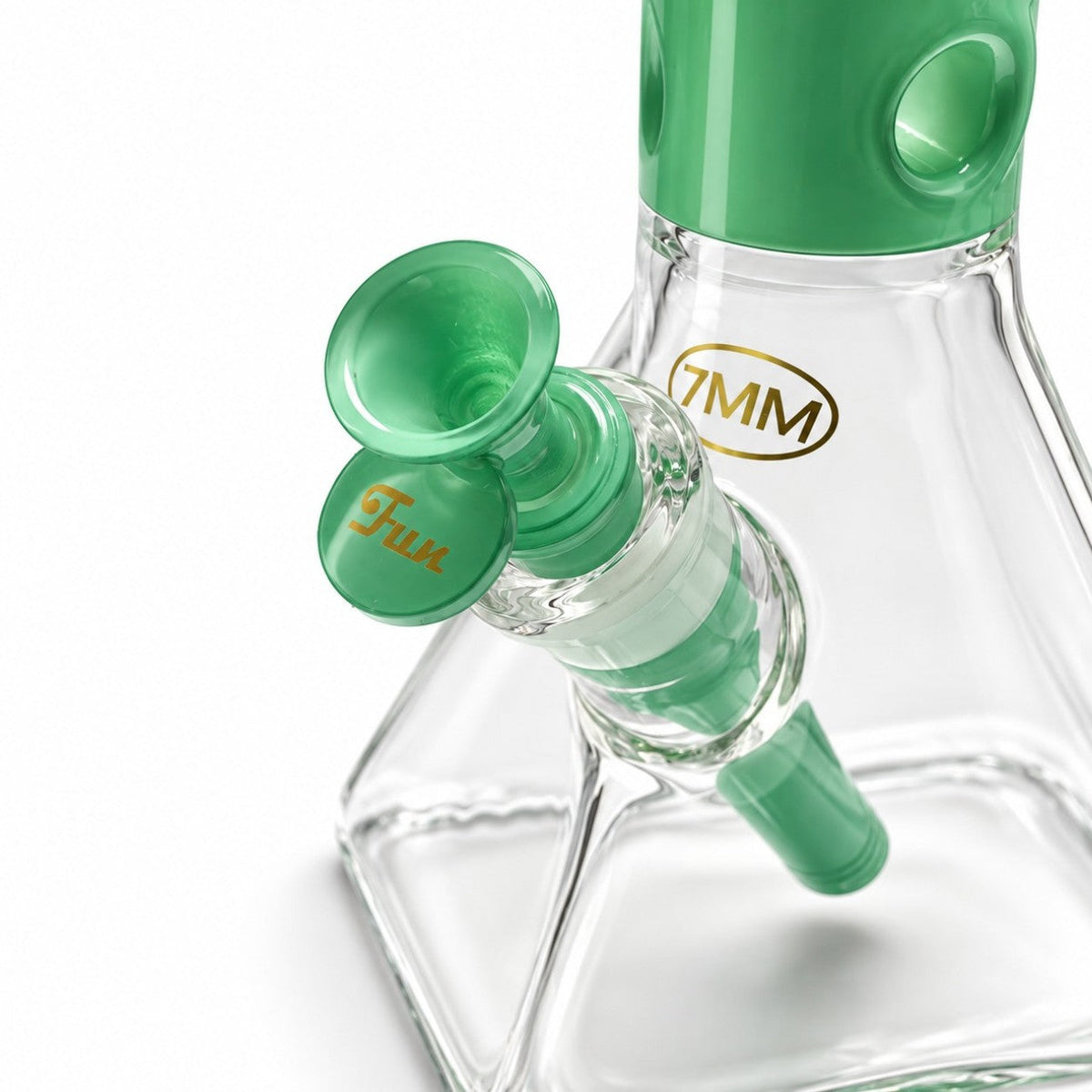Close-up of the Green Square Up bowl and downstem fitted into the clear chamber beside the gold 7MM mark