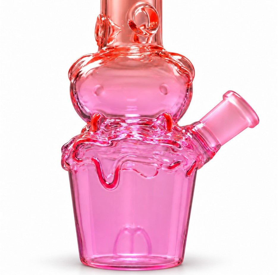Close-up of the Fortune Character Cup Bong’s smiling glass face, raised drip decoration and pink cup-shaped base