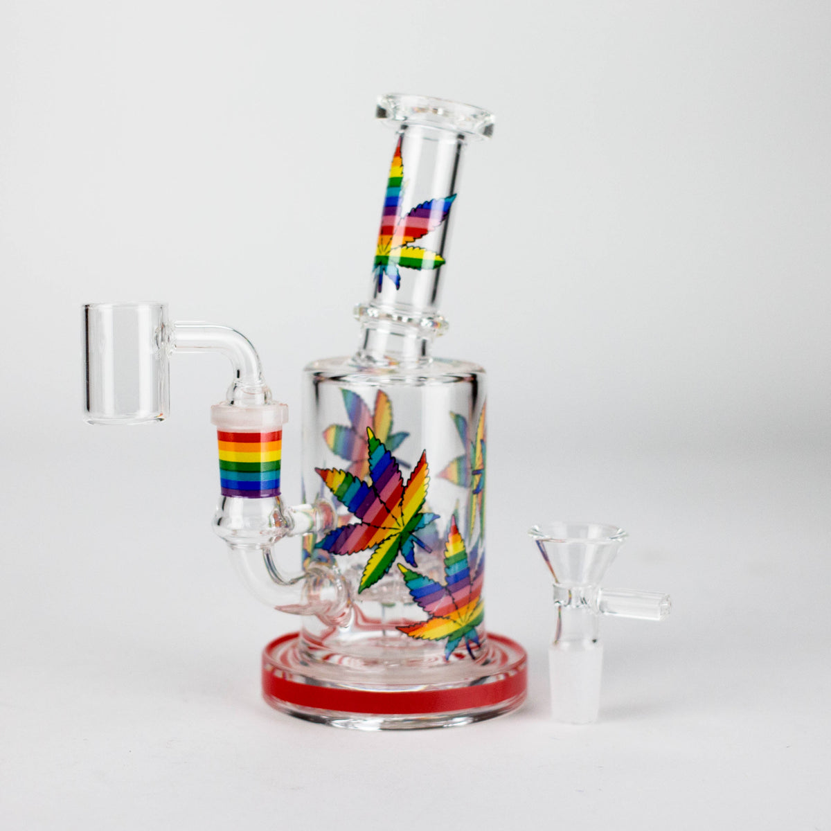 Red-base leaf rig with rainbow leaf pattern, banger fitted and glass bowl beside it