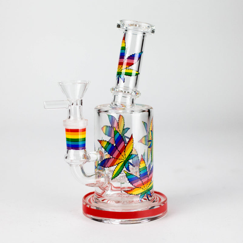 Red-base leaf print hybrid glass rig with rainbow graphics and its herb bowl installed