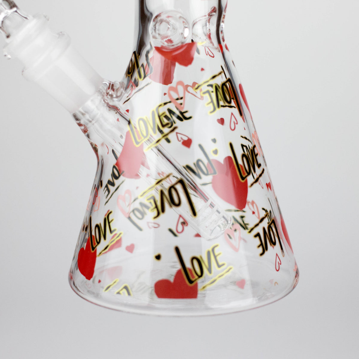 Heart and LOVE graphics around the clear beaker base with the removable downstem visible