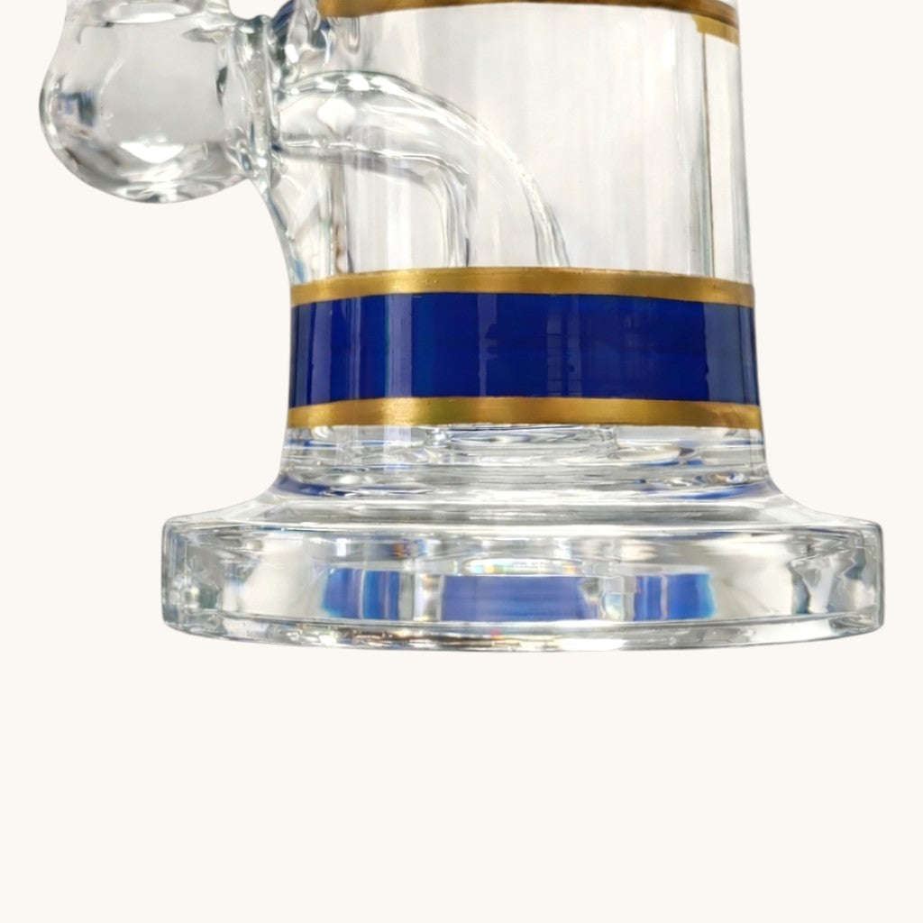 Front close-up of the Mini Crown blue-and-gold lower band and clear round glass base