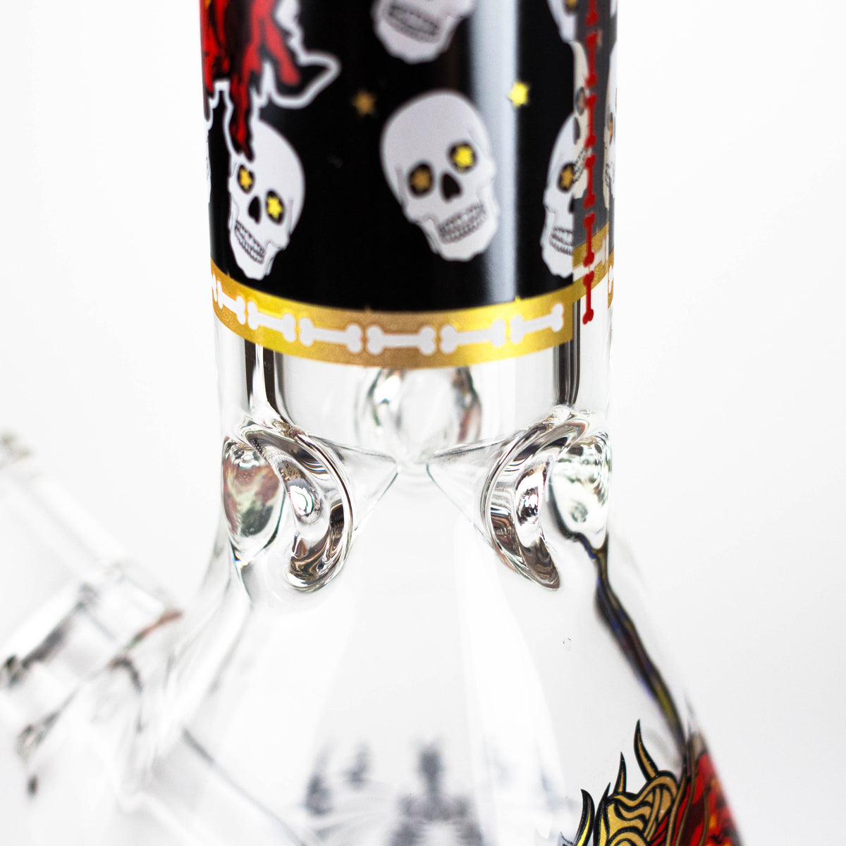 Glass ice pinches below the skull-patterned neck of the monster face beaker bong