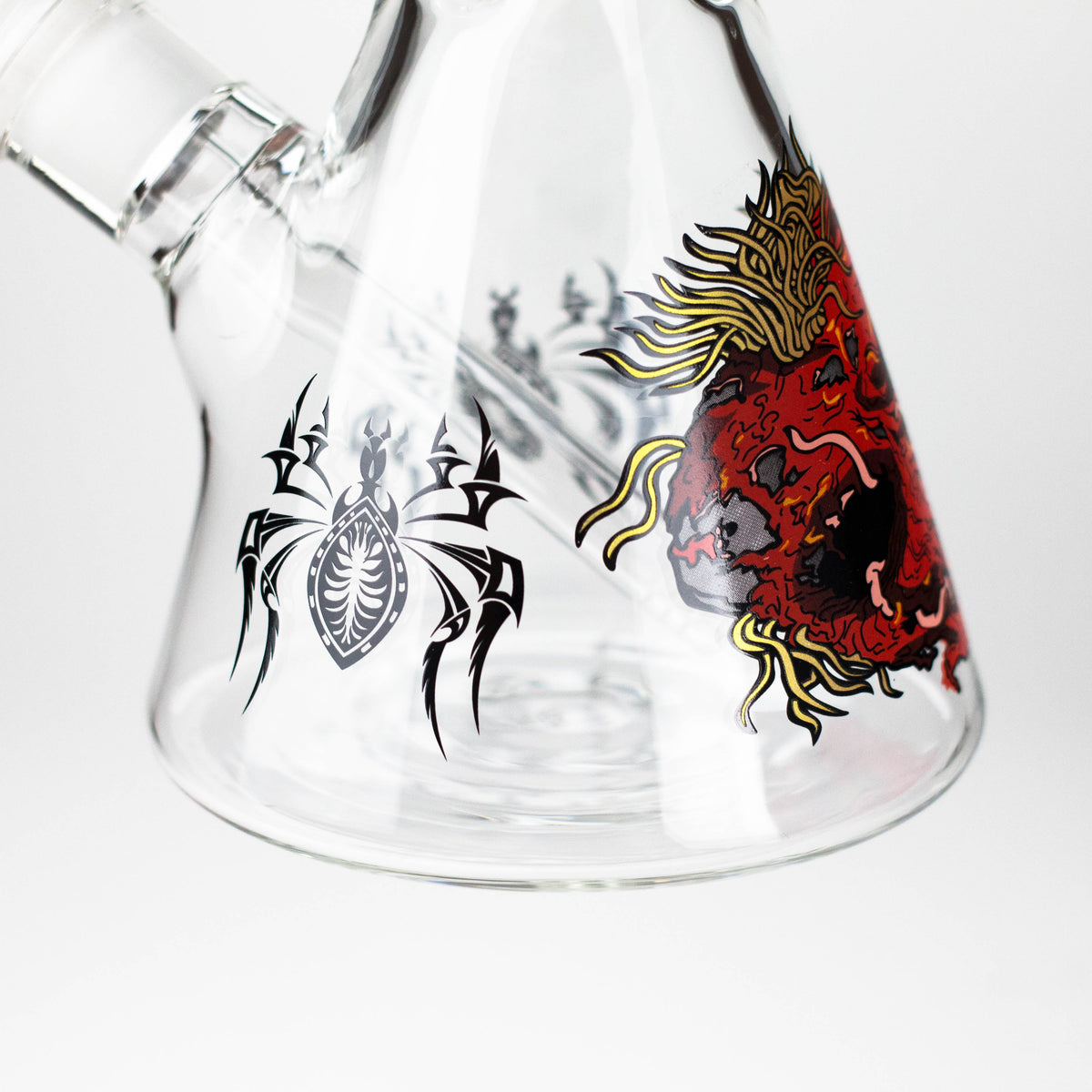 Red monster and black spider graphics around the clear beaker base with downstem visible