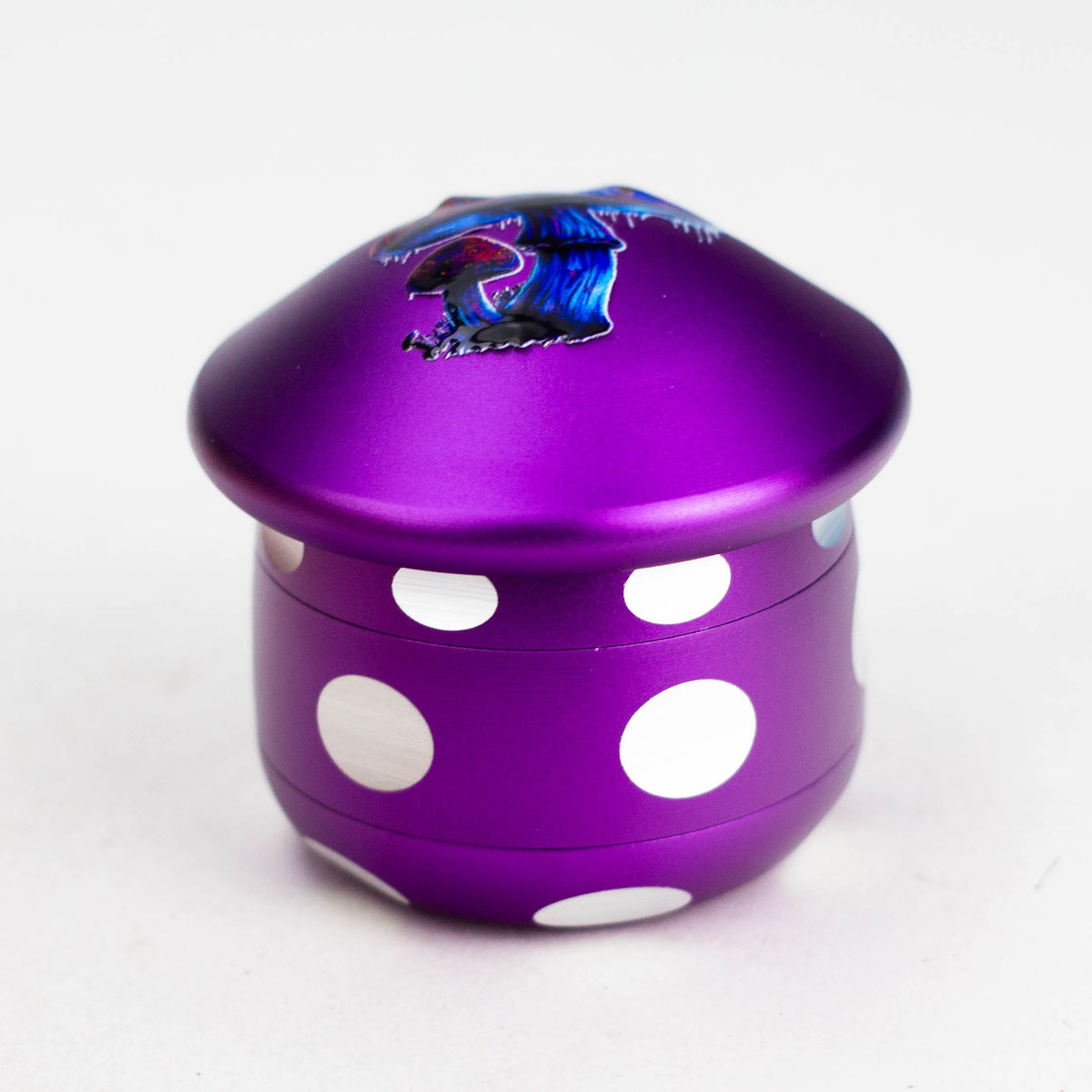 Purple aluminium mushroom grinder with white circular spots and blue mushroom cap illustration