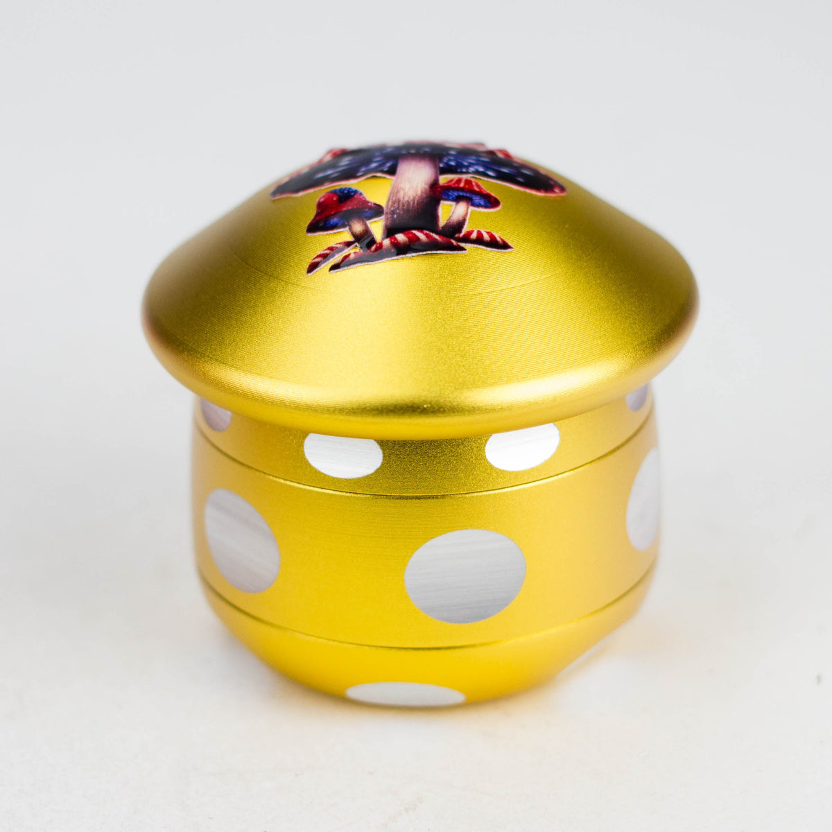Yellow aluminium mushroom herb grinder with white dots and a wide rounded cap