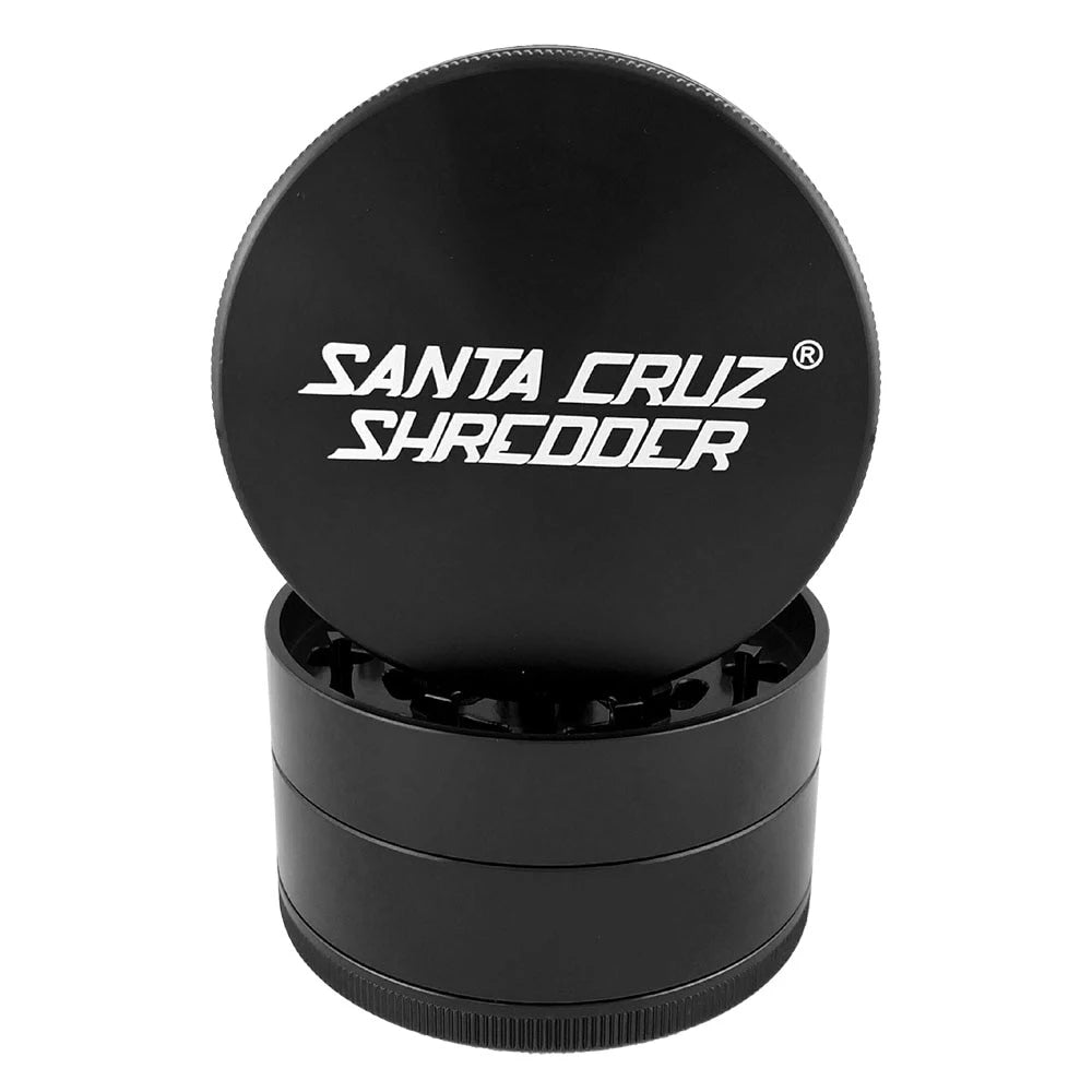Black Santa Cruz Shredder large four-piece grinder with its logo lid lifted above the teeth