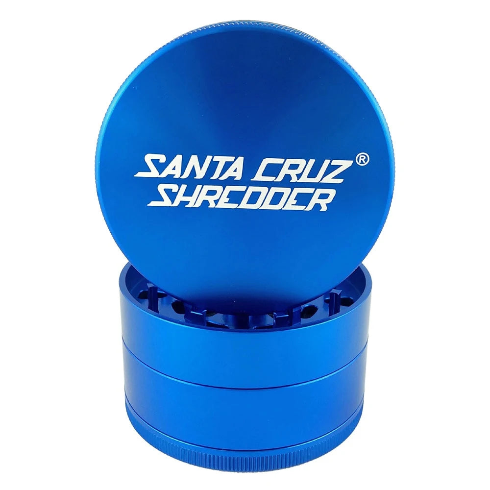 Blue Santa Cruz Shredder four-piece grinder with white lid logo and matching blue body