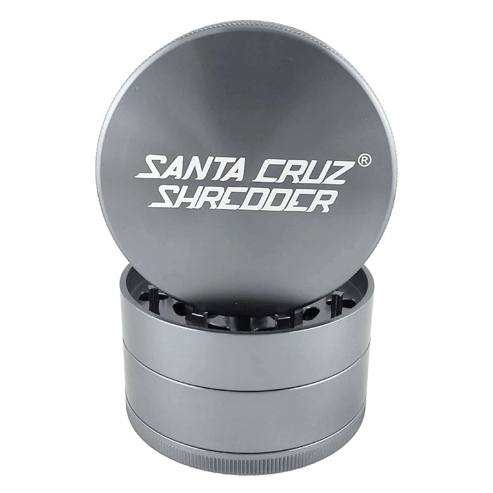 Grey Santa Cruz Shredder large four-piece herb grinder showing its logo lid and cutting chamber