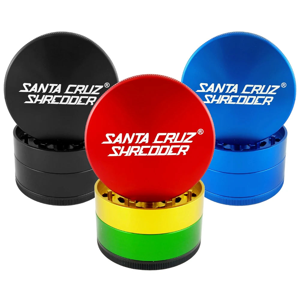 Santa Cruz Shredder large four-piece grinders in Black, Blue and Rasta with lids lifted
