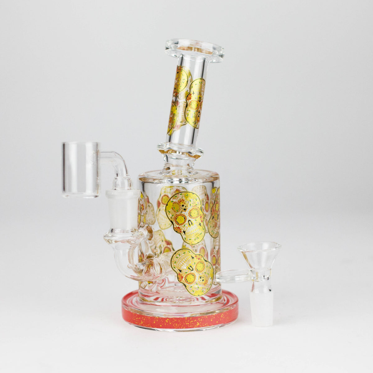 Red-trim sugar skull glass rig with the banger fitted and included bowl beside the base
