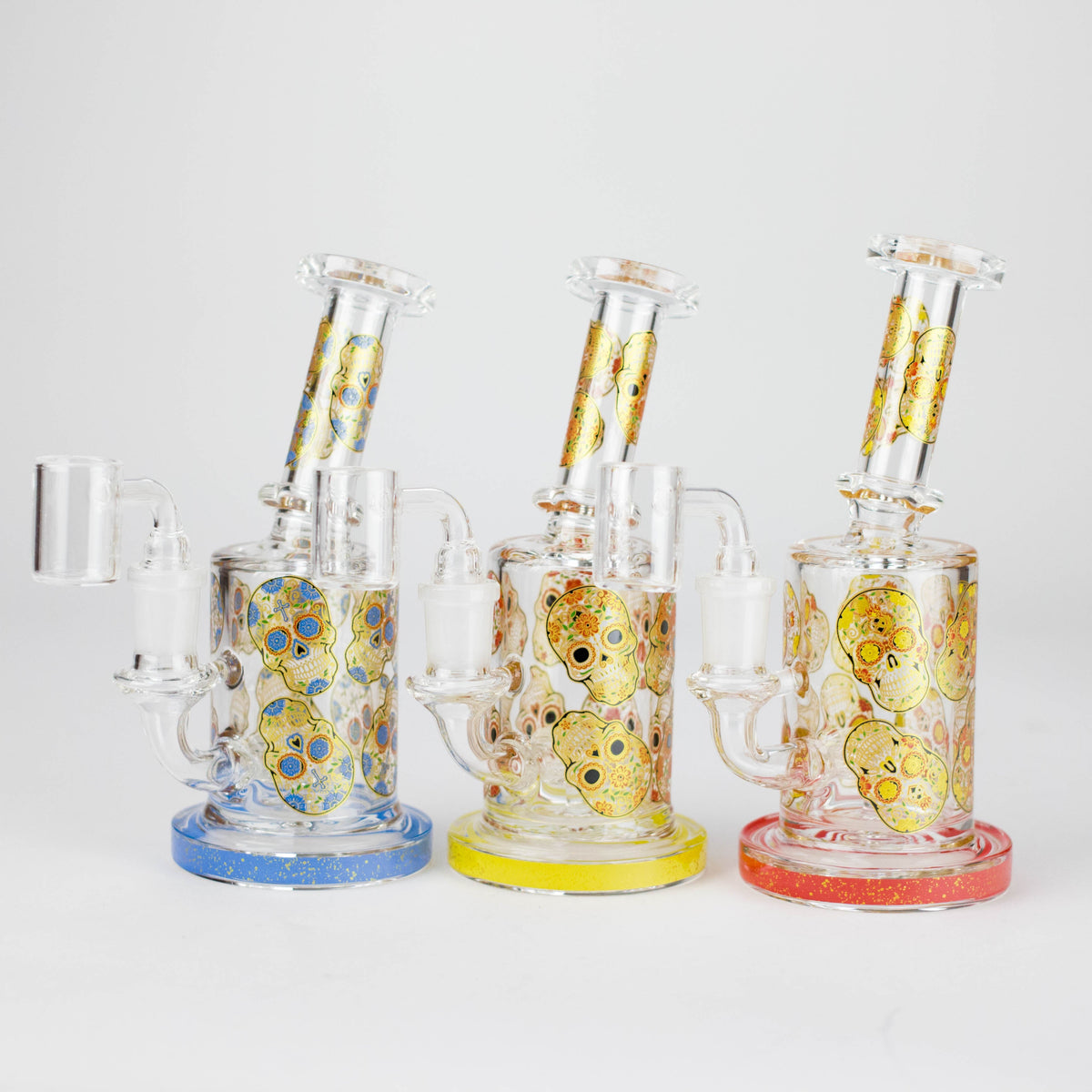 Blue, Yellow and Red sugar skull dab rigs together showing matching trim and skull graphics