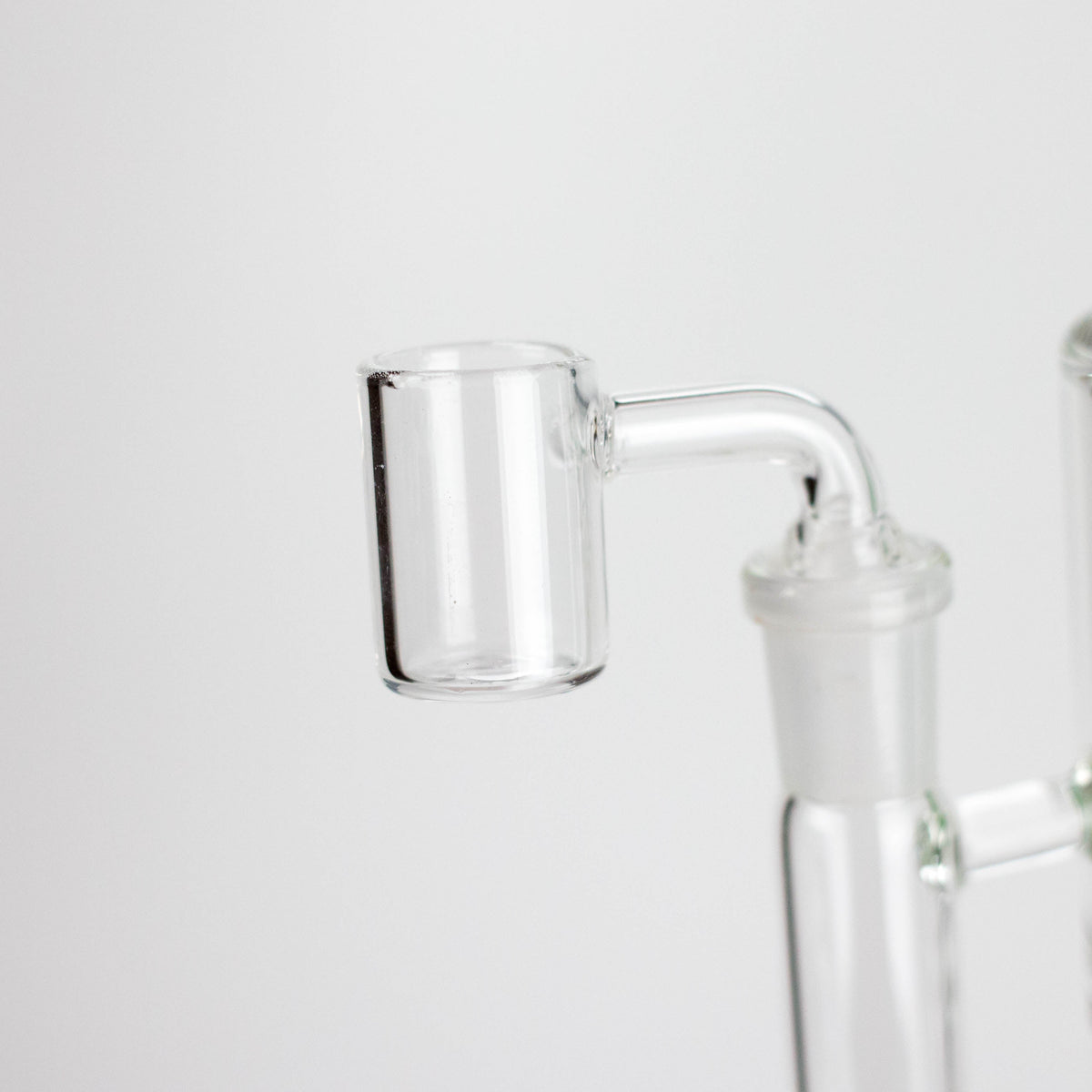 Close-up of the Triangle rig’s supplied glass banger fitted into the side joint