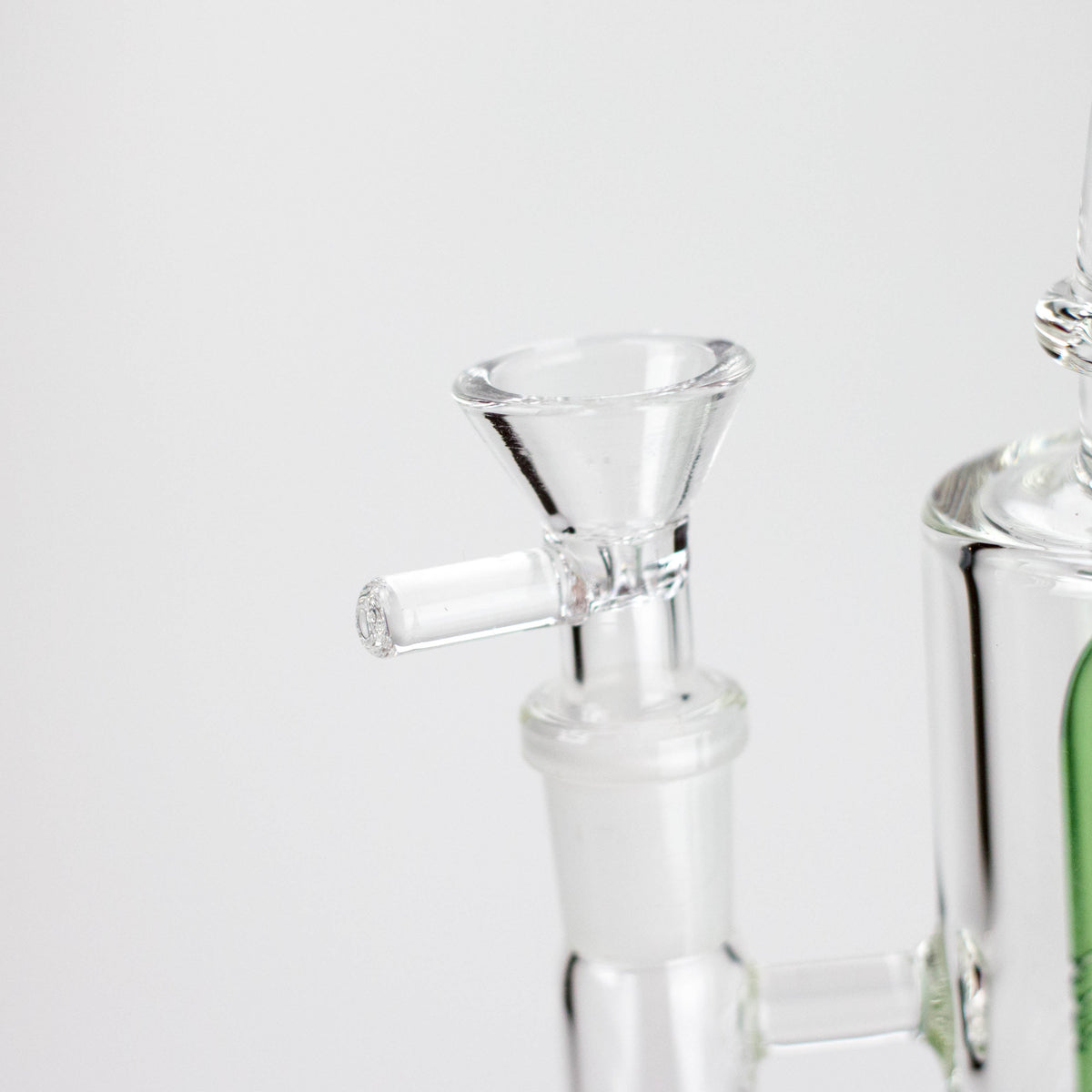 Triangle rig’s included glass bowl with a clear side handle