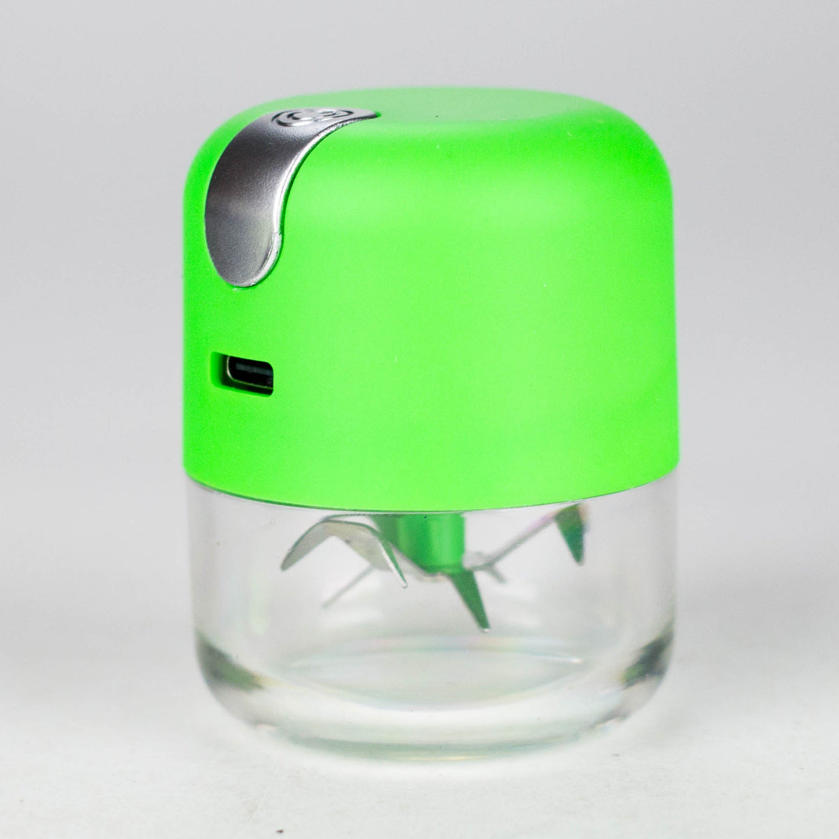 Green USB electric grinder with a bright green metal body, silver button and clear lower chamber
