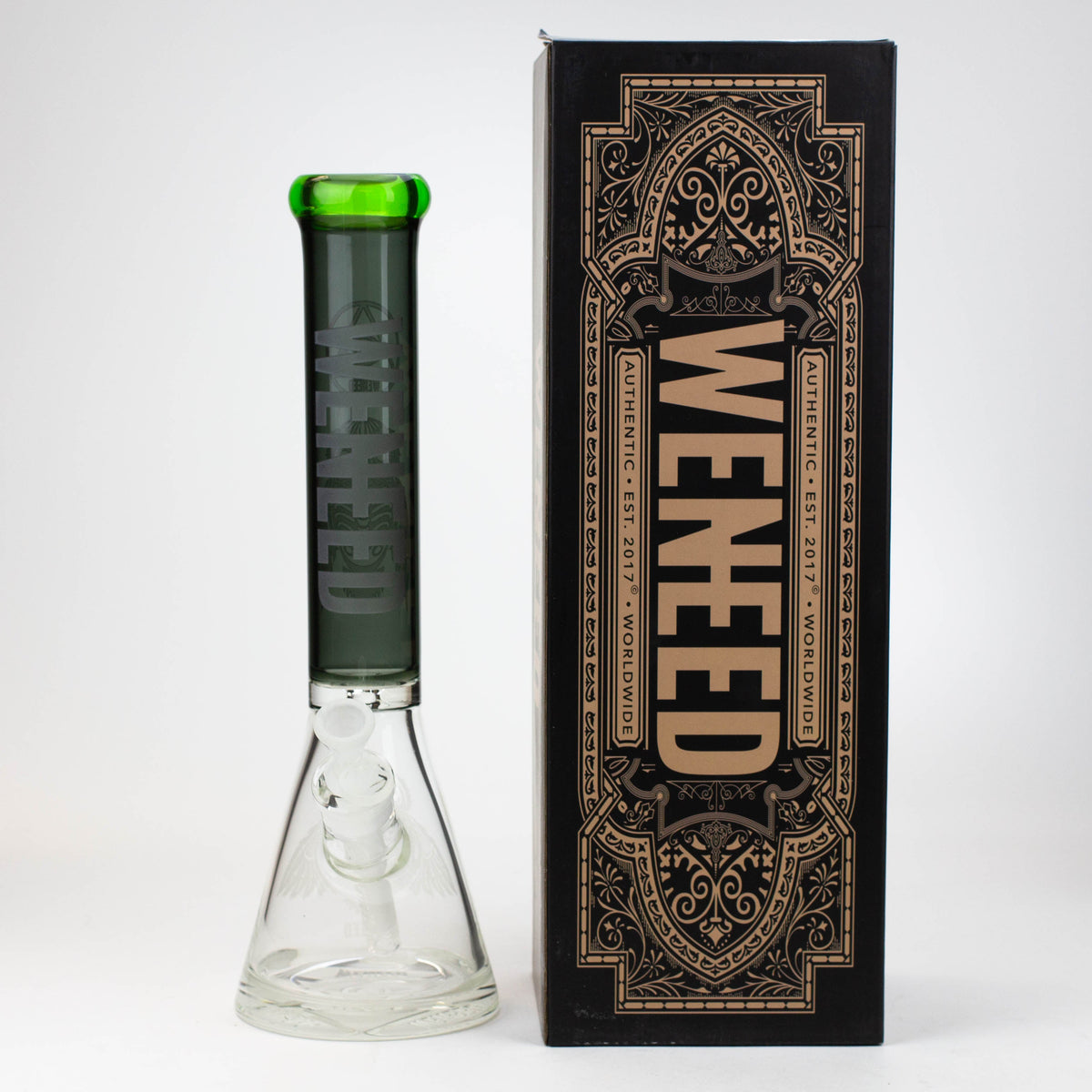 Black and green WENEED® 15-inch glass beaker bong beside box.