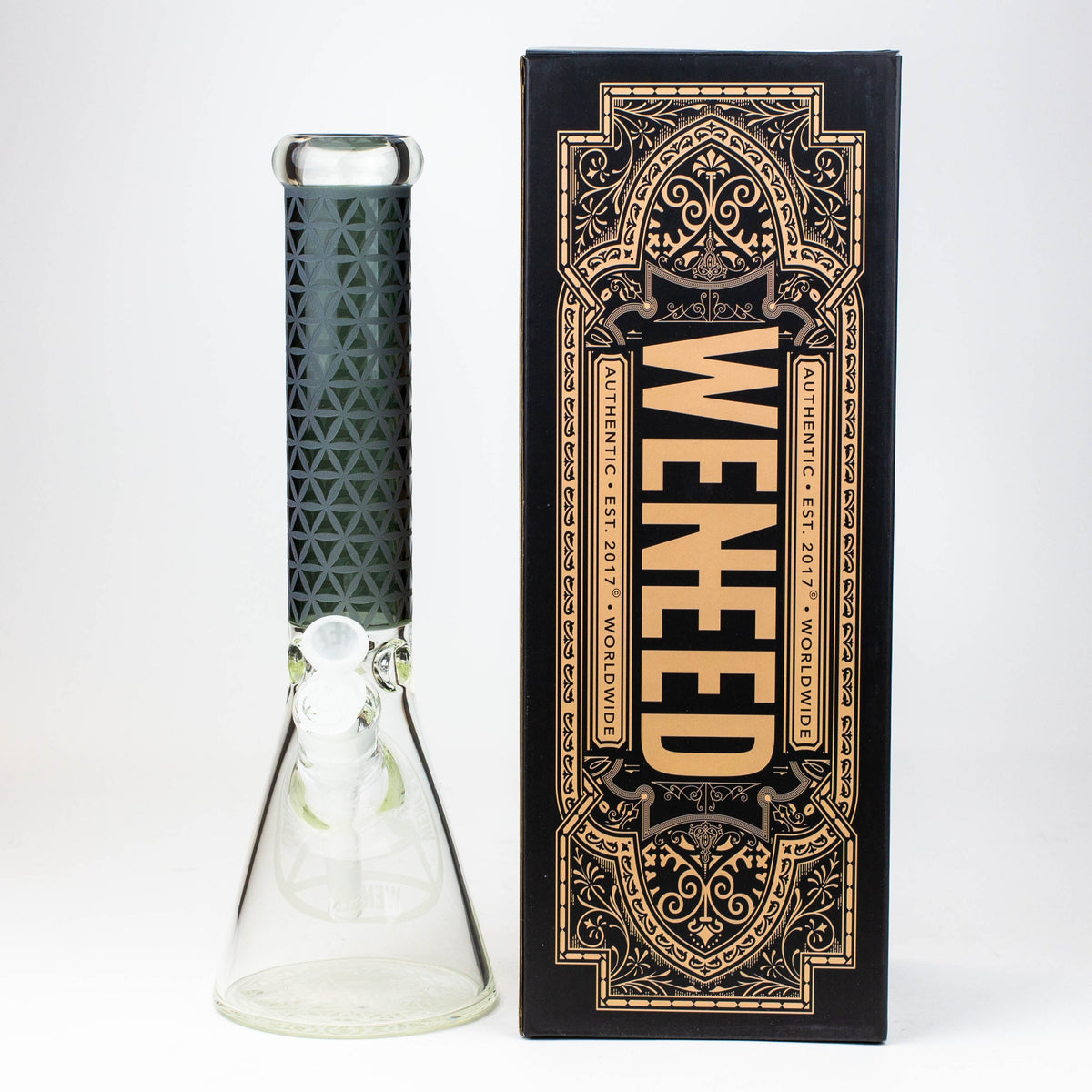 Black WENEED Vector Grid Beaker Bong pictured next to box.